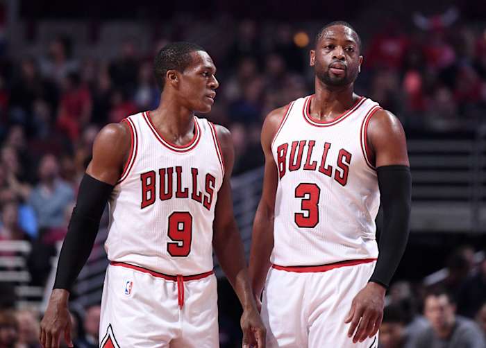 Chicago Bulls guard Rajon Rondo (9) talks with guard Dwyane Wade (3) during the first half against the Washington Wizards at the United Center.